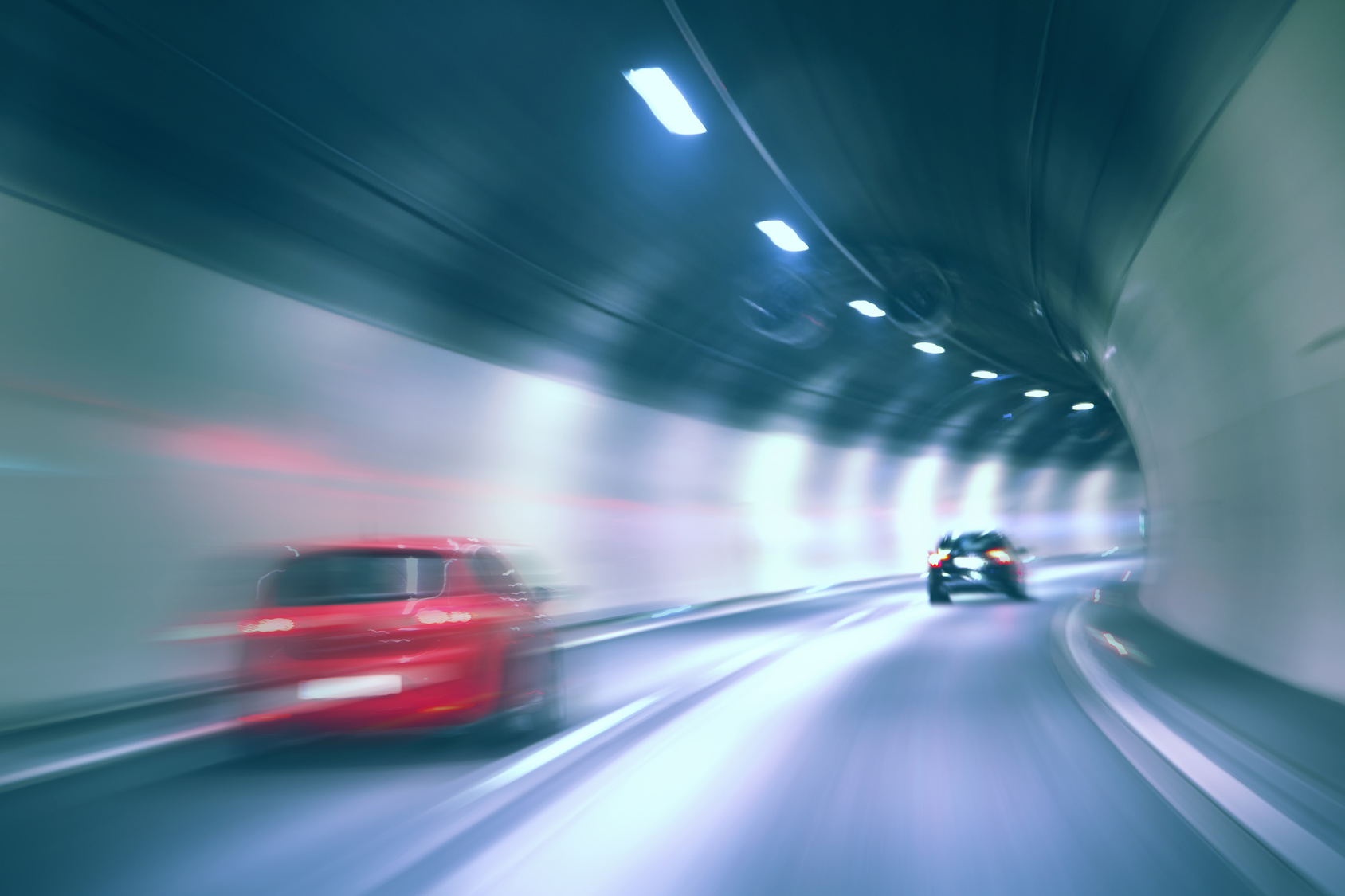 Tunnel dangerous high speed motion blurred vehicle driving. Blue color ...